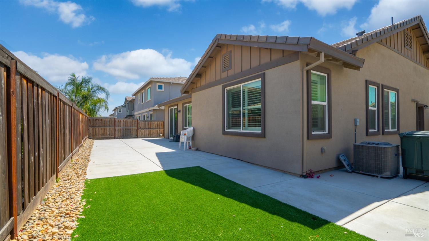 761 Razorbill Street Vacaville, CA 95688 - Photo 26 of 41 a view of backyard with large tree and wooden fence