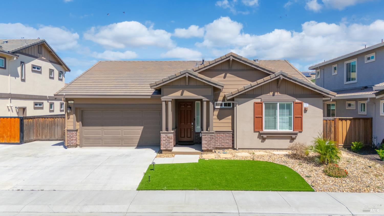 761 Razorbill Street Vacaville, CA 95688 - Photo 29 of 41 a view of a white house with a small yard and plants