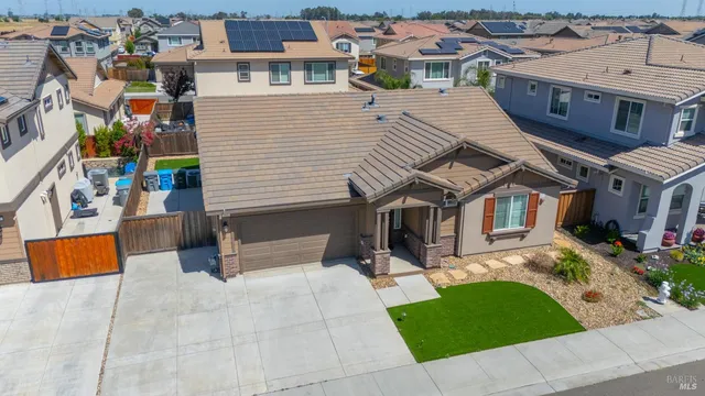 an aerial view of a house with outdoor space