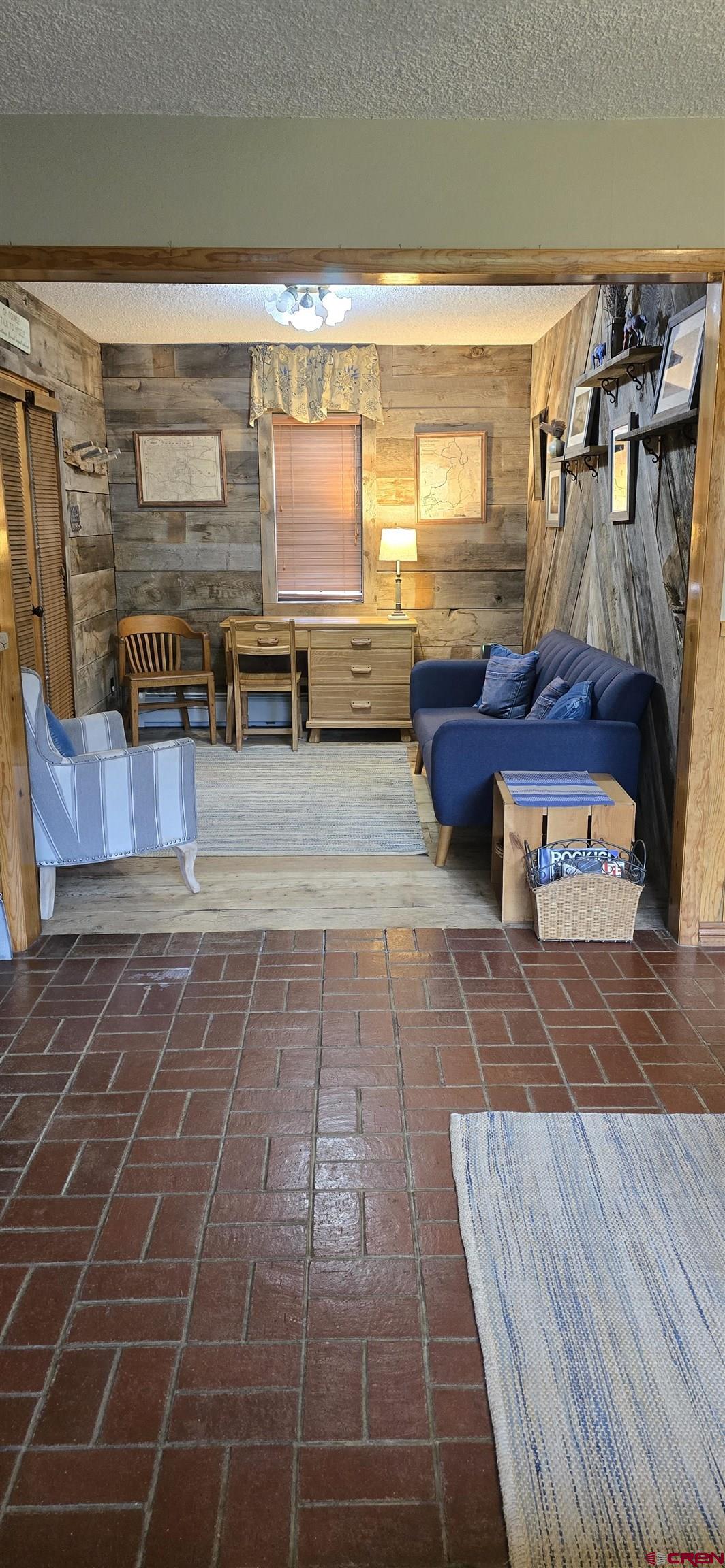 605 County Road 23 Ridgway, CO 81432 - Photo 12 of 26 a view of a balcony with chairs and wooden floor