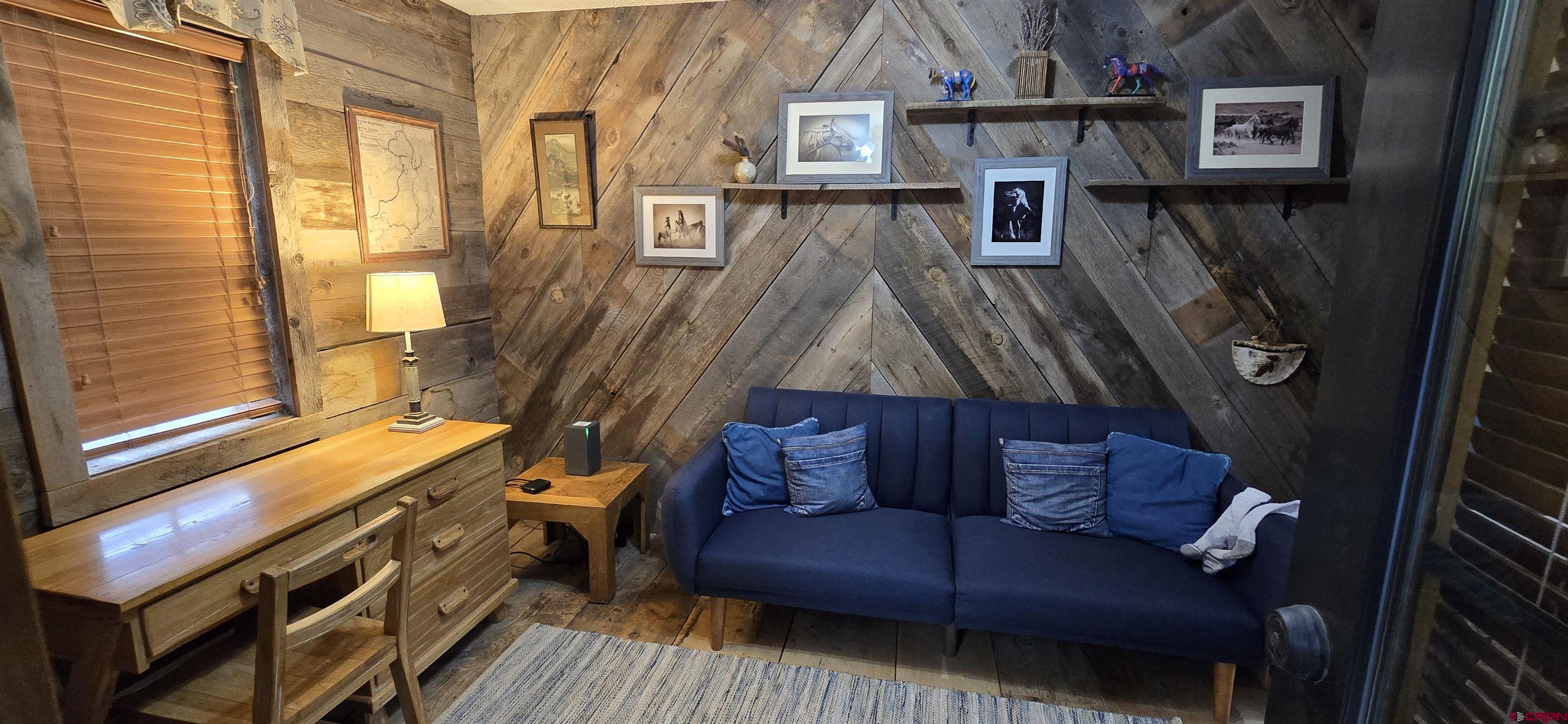605 County Road 23 Ridgway, CO 81432 - Photo 14 of 26 a living room with furniture and a window