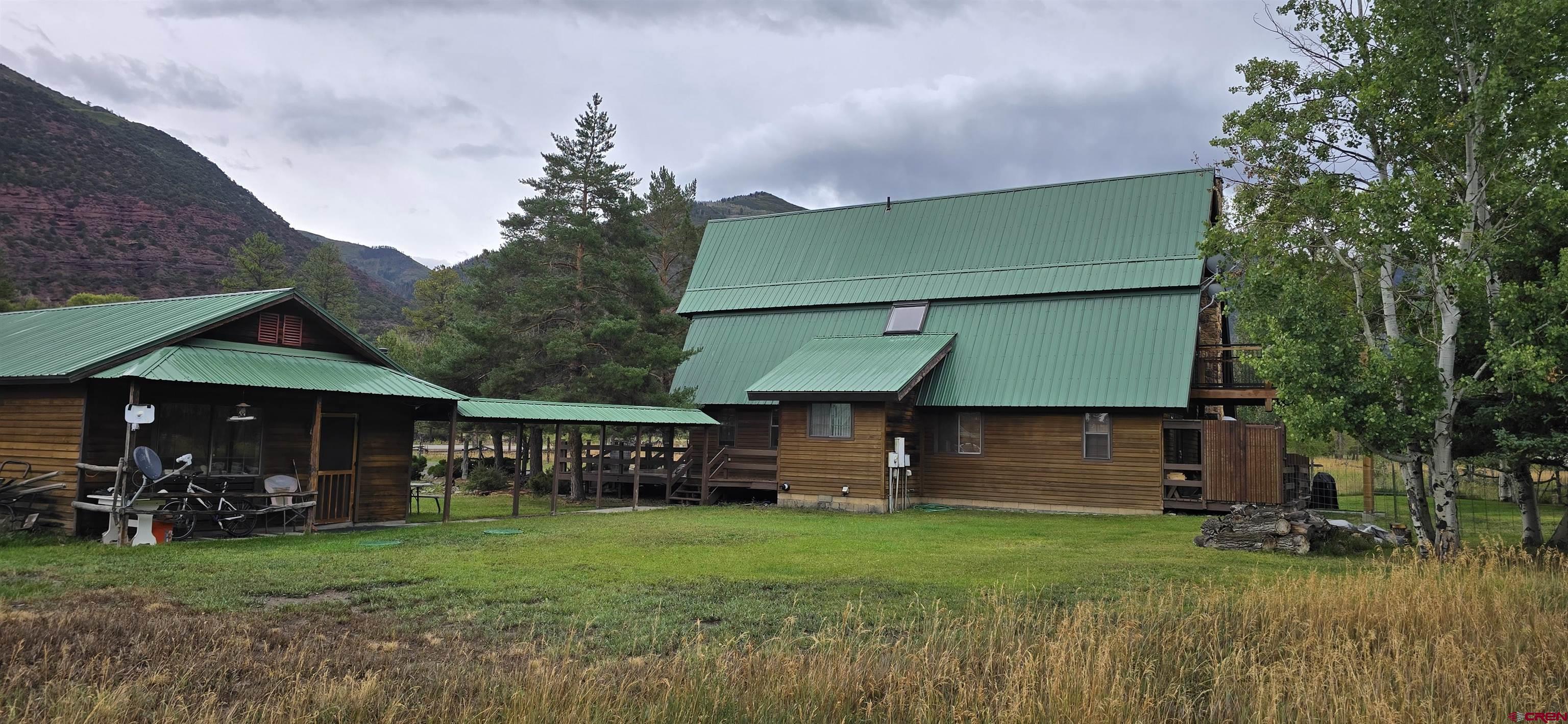 605 County Road 23 Ridgway, CO 81432 - Photo 22 of 26 a front view of a house with a garden