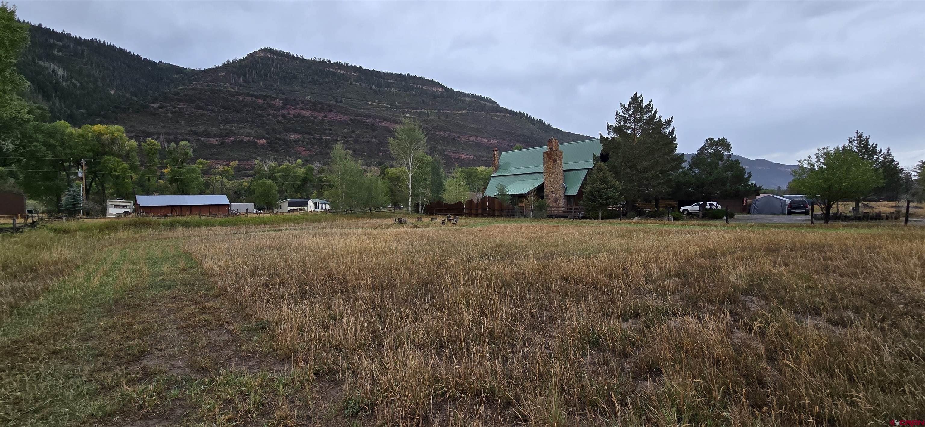 605 County Road 23 Ridgway, CO 81432 - Photo 25 of 26 a view of a town with barn house in the background