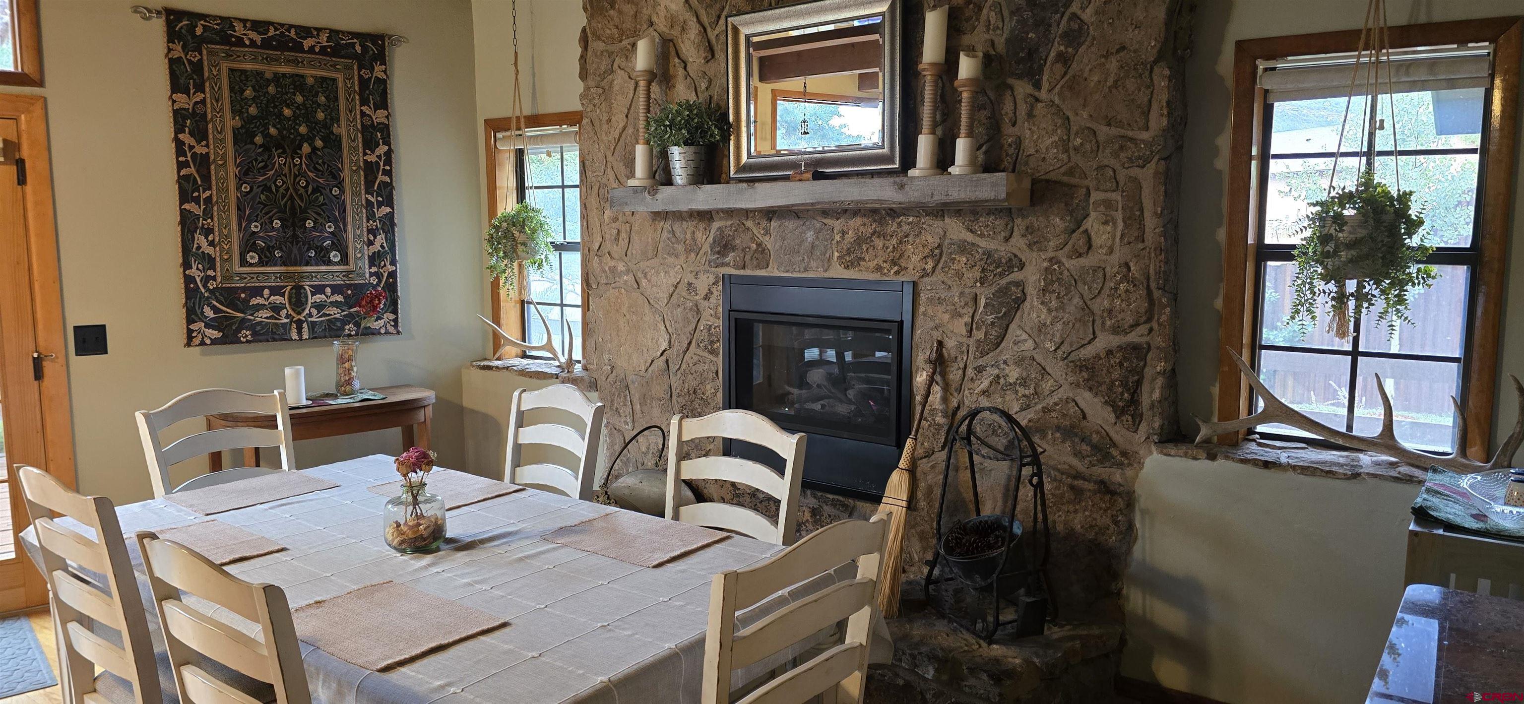 605 County Road 23 Ridgway, CO 81432 - Photo 9 of 26 a view of a dining room with furniture and window