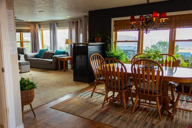 a view of a dining room with furniture window and outside view