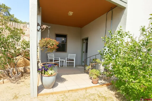 a living room filled with furniture and flowers