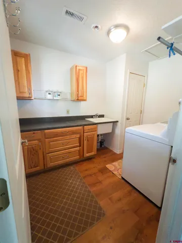 a room with a sink and a mirror