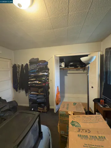 a bedroom with a bed and furniture