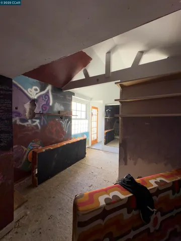 a view of a livingroom with furniture and windows