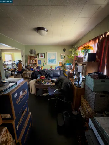 a living room with lots of furniture and a flat screen tv