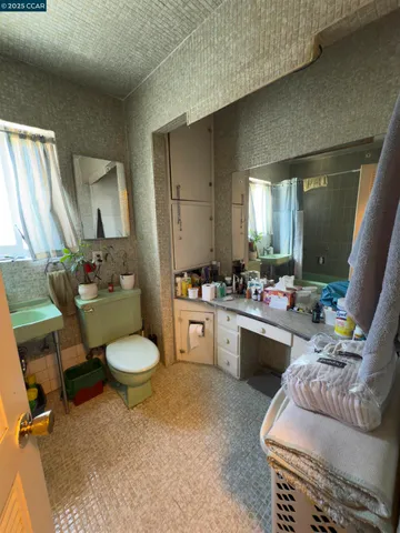 a living room with furniture a window and a sink