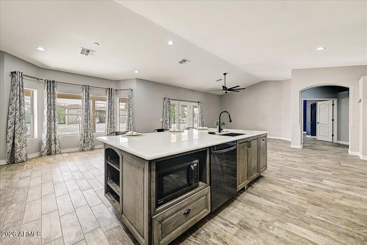 7624 North Citrus Road Waddell, AZ 85355 - Photo 18 of 57 a kitchen with a stove and a sink
