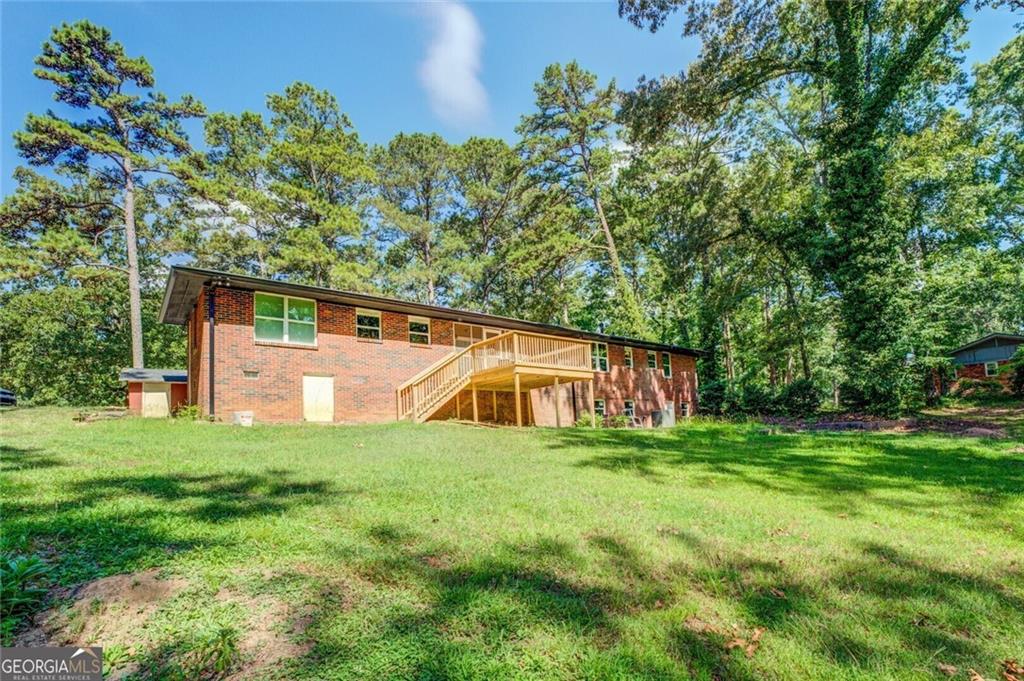 1288 Elva Drive Southwest Atlanta, GA 30331 - Photo 2 of 13 a view of a house with a yard
