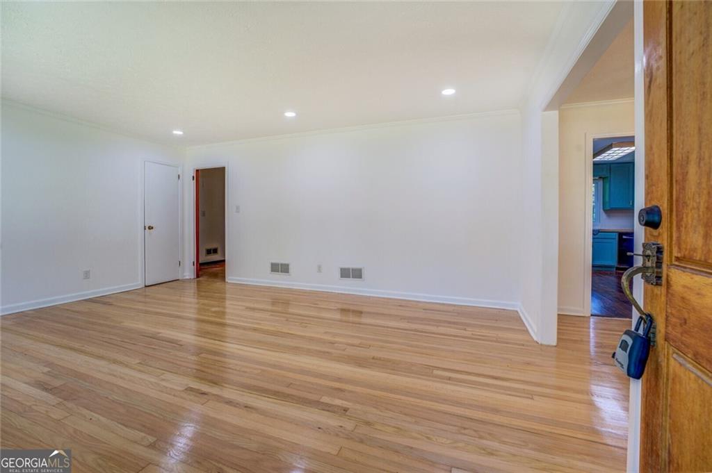 1288 Elva Drive Southwest Atlanta, GA 30331 - Photo 5 of 13 a view of an empty room with wooden floor
