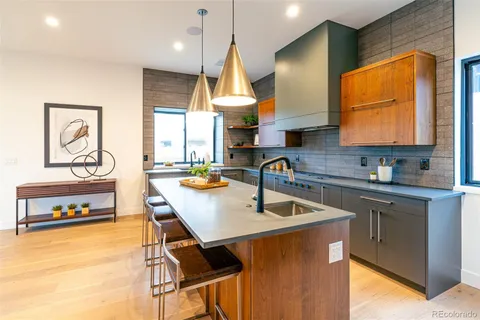 a kitchen with a table chairs sink and window