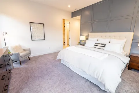 a bedroom with bed and window