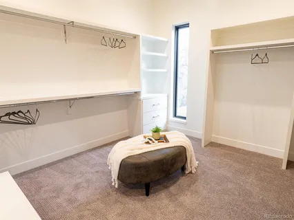 a bedroom with a bed and a table