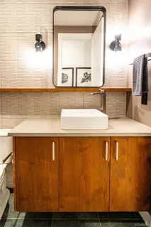 a bathroom with a sink and a mirror