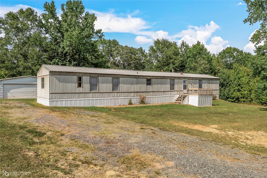 front view of a house with a big yard