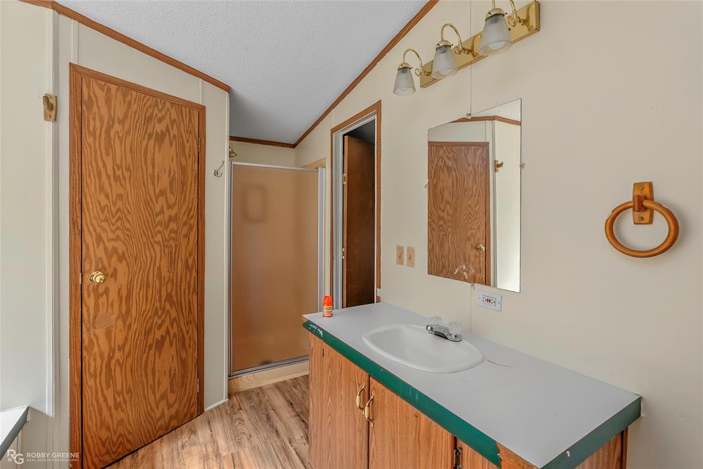 214 Springs Road Frierson, LA 71027 - Photo 15 of 21 a bathroom with a sink and a mirror