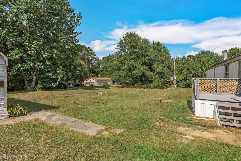 214 Springs Road Frierson, LA 71027 - Photo 4 of 21 a view of a house with a yard