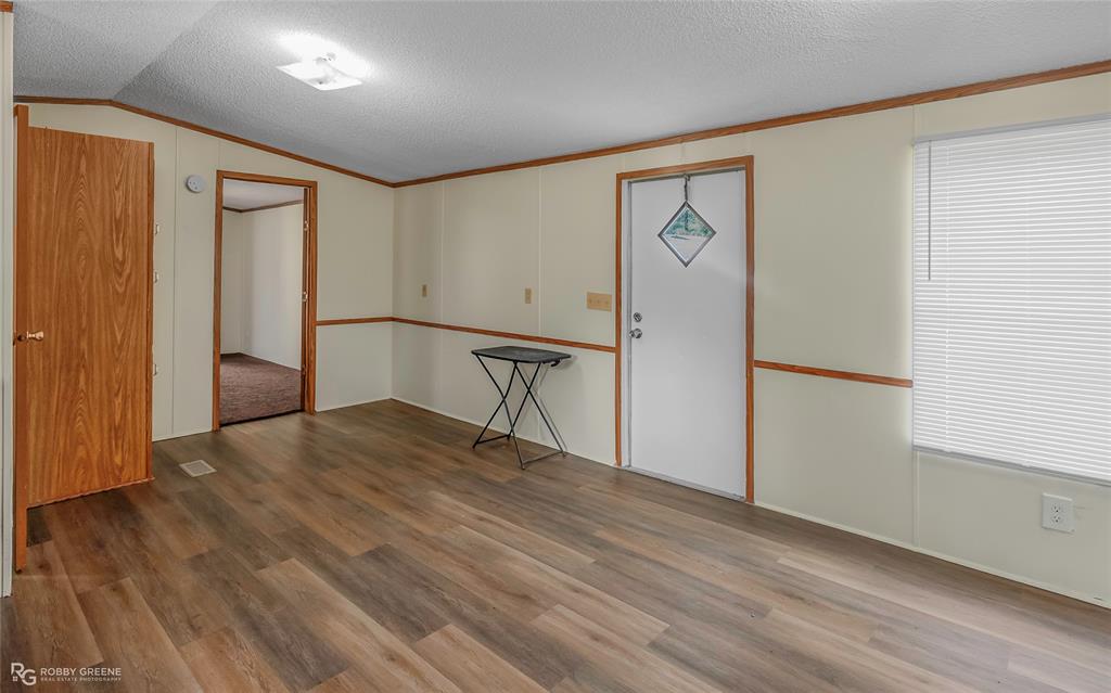 214 Springs Road Frierson, LA 71027 - Photo 9 of 21 a view of empty room with wooden floor