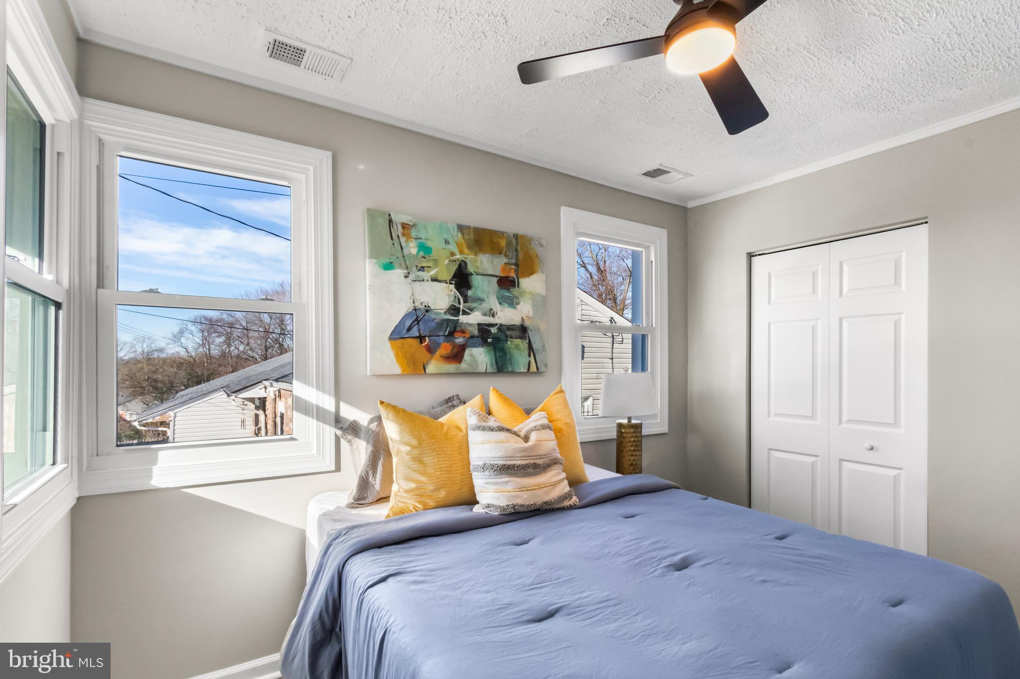 7736 Oxman Road Landover, MD 20785 - Photo 19 of 30 a bedroom with a bed and wooden floor
