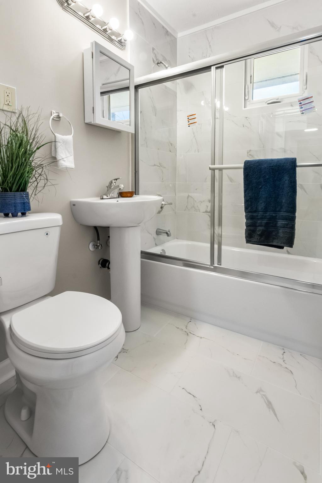 7736 Oxman Road Landover, MD 20785 - Photo 21 of 30 a bathroom with a sink toilet and shower