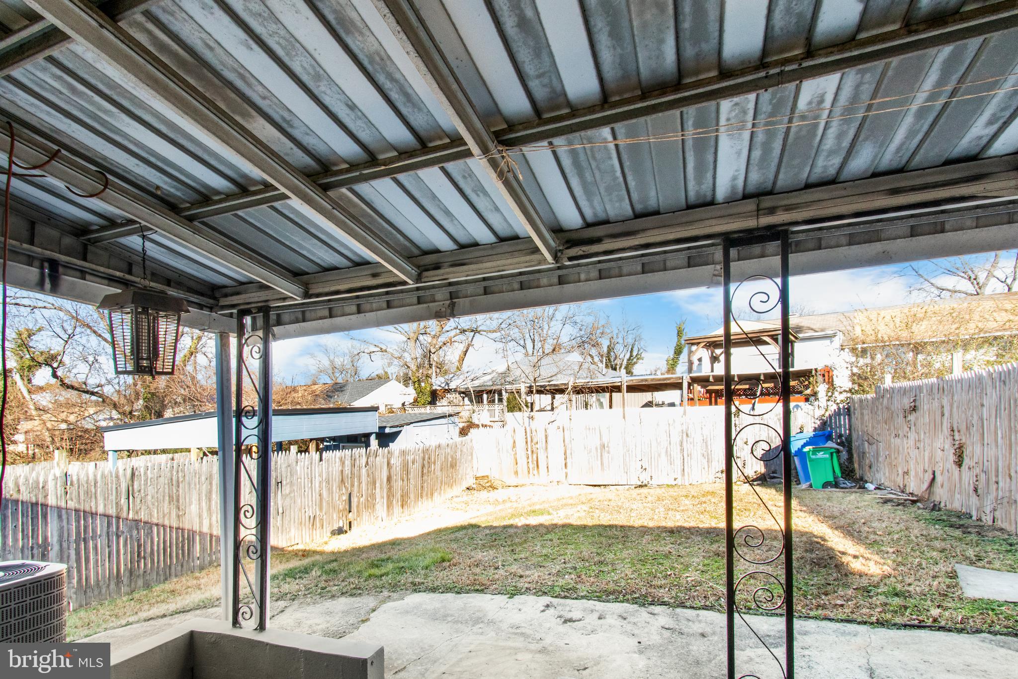 7736 Oxman Road Landover, MD 20785 - Photo 26 of 30 a backyard of a house with a fountain