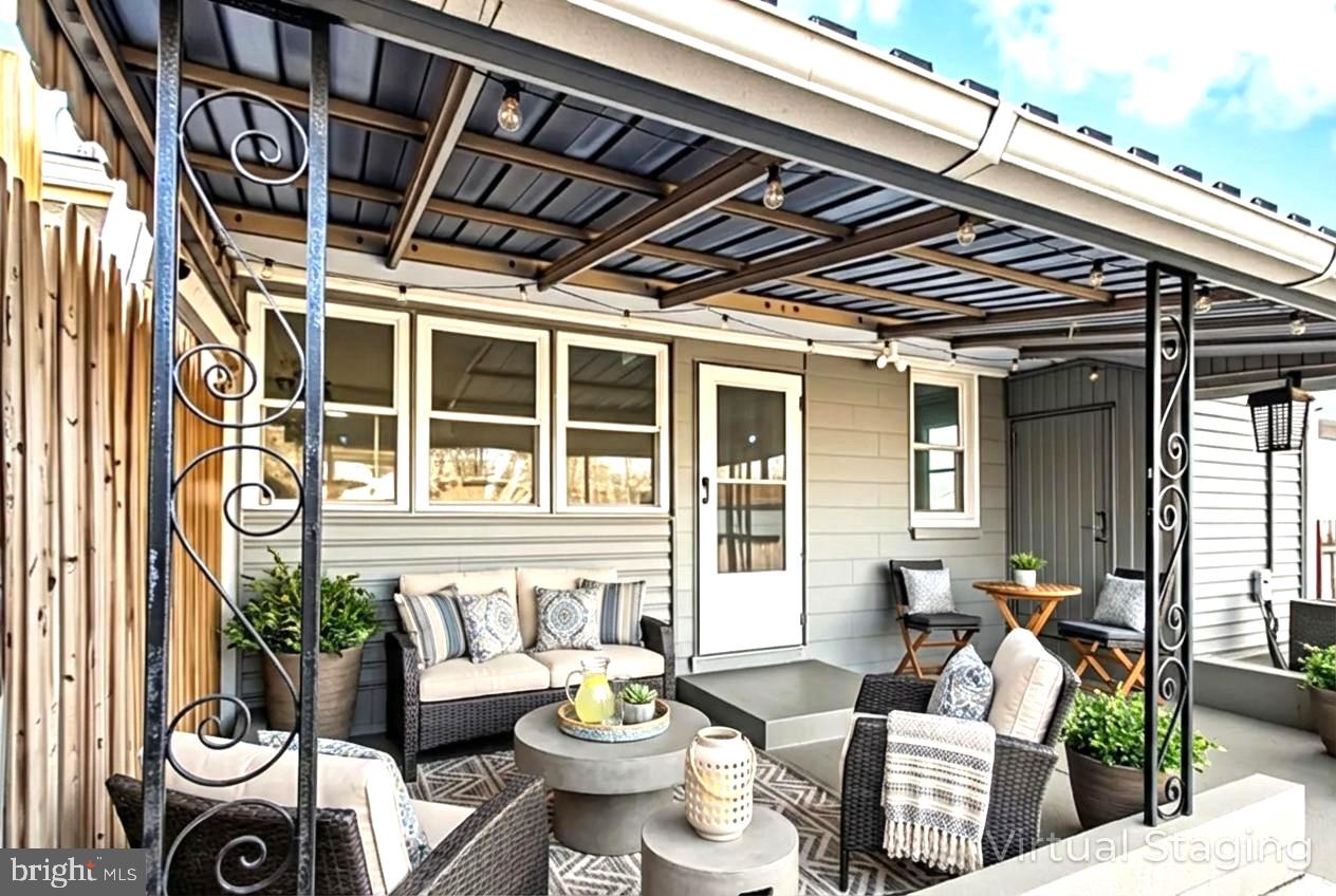 7736 Oxman Road Landover, MD 20785 - Photo 29 of 30 a outdoor living space with furniture and umbrella