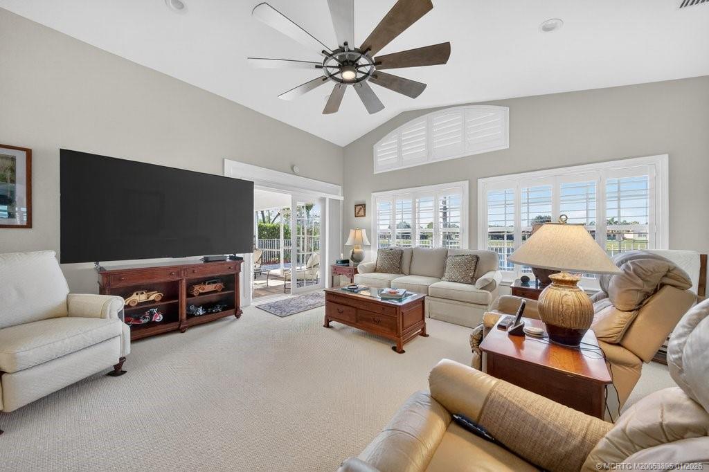 871 Southeast Westminster Place Stuart, FL 34997 - Photo 17 of 38 French Doors open to delightful custom addition, complete with bath, closet and patio access.