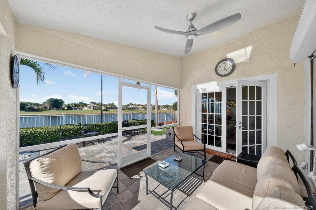 871 Southeast Westminster Place Stuart, FL 34997 - Photo 29 of 38 Newly refinished screened patio with stunning pavers and landscaping.