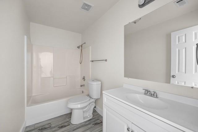 13741 Biggs Street Dallas, TX 75253 - Photo 13 of 17 a bathroom with a sink toilet and shower