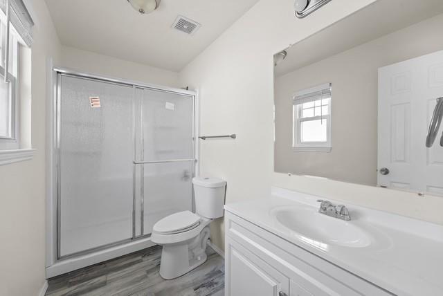 13741 Biggs Street Dallas, TX 75253 - Photo 14 of 17 a bathroom with a sink a toilet and shower