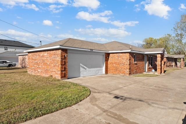 13741 Biggs Street Dallas, TX 75253 - Photo 16 of 17 a front view of a house with a garden and entryway