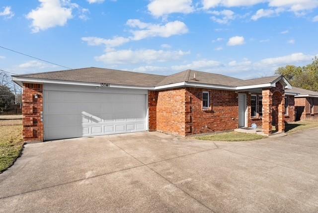 13741 Biggs Street Dallas, TX 75253 - Photo 4 of 17 a front view of a house with a garage