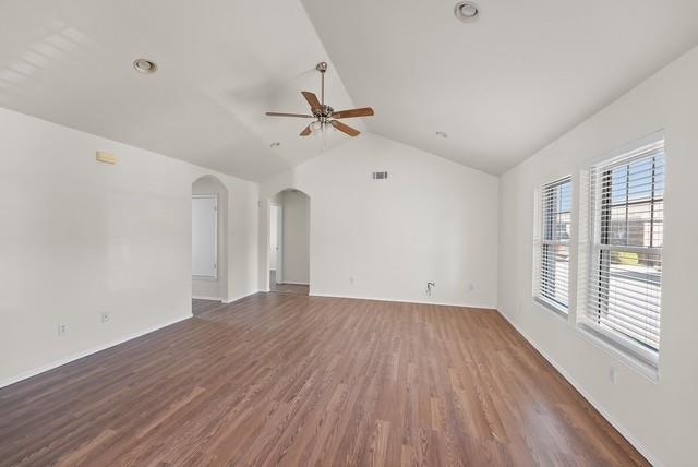 13741 Biggs Street Dallas, TX 75253 - Photo 6 of 17 a view of empty room with wooden floor and fan