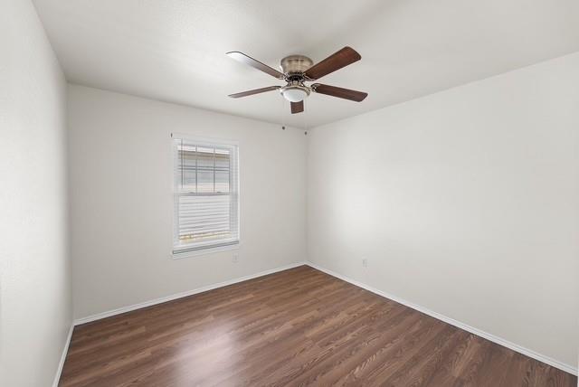 13741 Biggs Street Dallas, TX 75253 - Photo 10 of 17 a view of a big room with wooden floor and windows