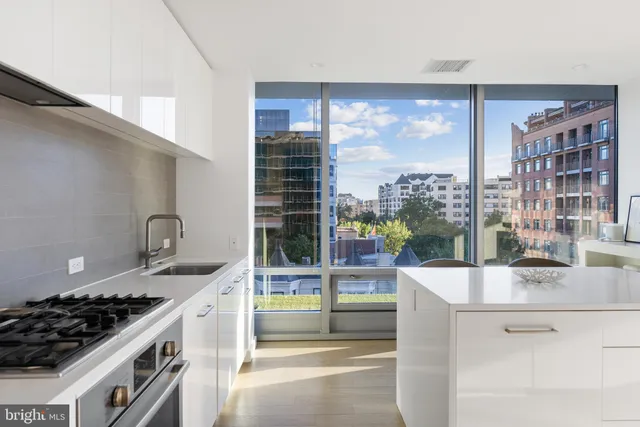a bedroom with a bed and glass window