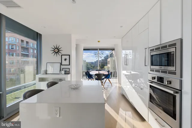 a kitchen with a stove a sink and a refrigerator