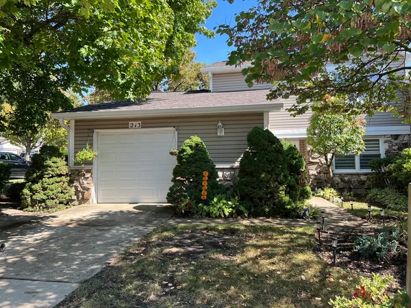 a view of a house with a tree