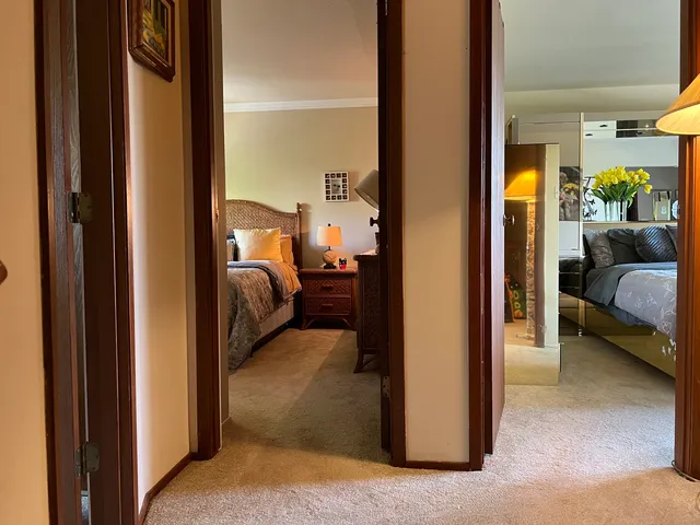 a view of a bedroom from a corridor