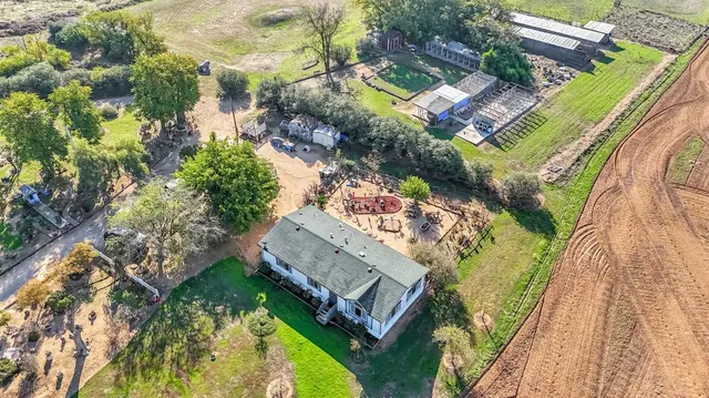 an aerial view of a house with a garden