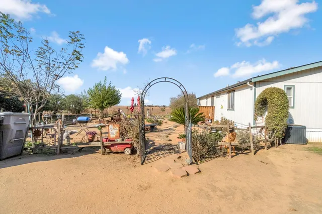 a view of a swimming pool with outdoor seating