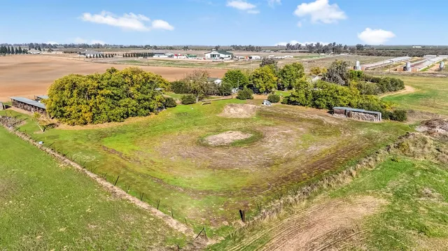 a view of a house with yard and lake view