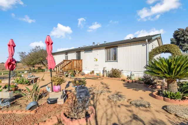 a view of a porch with potted plants