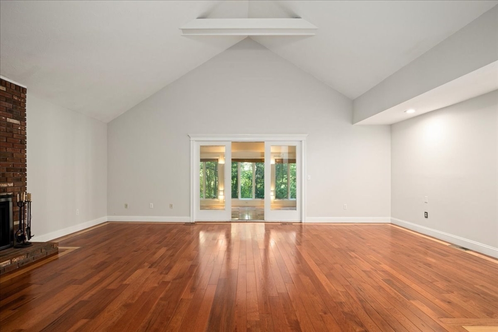 8 Arch Street Shrewsbury, MA 01545 - Photo 11 of 42 wooden floor in an empty room with a window