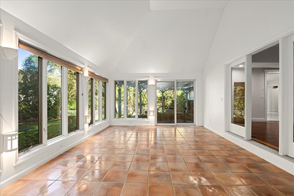 8 Arch Street Shrewsbury, MA 01545 - Photo 13 of 42 a view of an empty room with windows and balcony