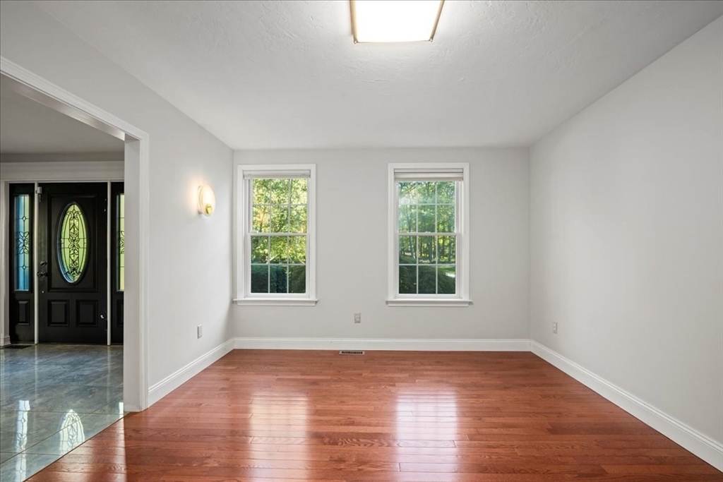 8 Arch Street Shrewsbury, MA 01545 - Photo 15 of 42 an empty room with wooden floor and windows