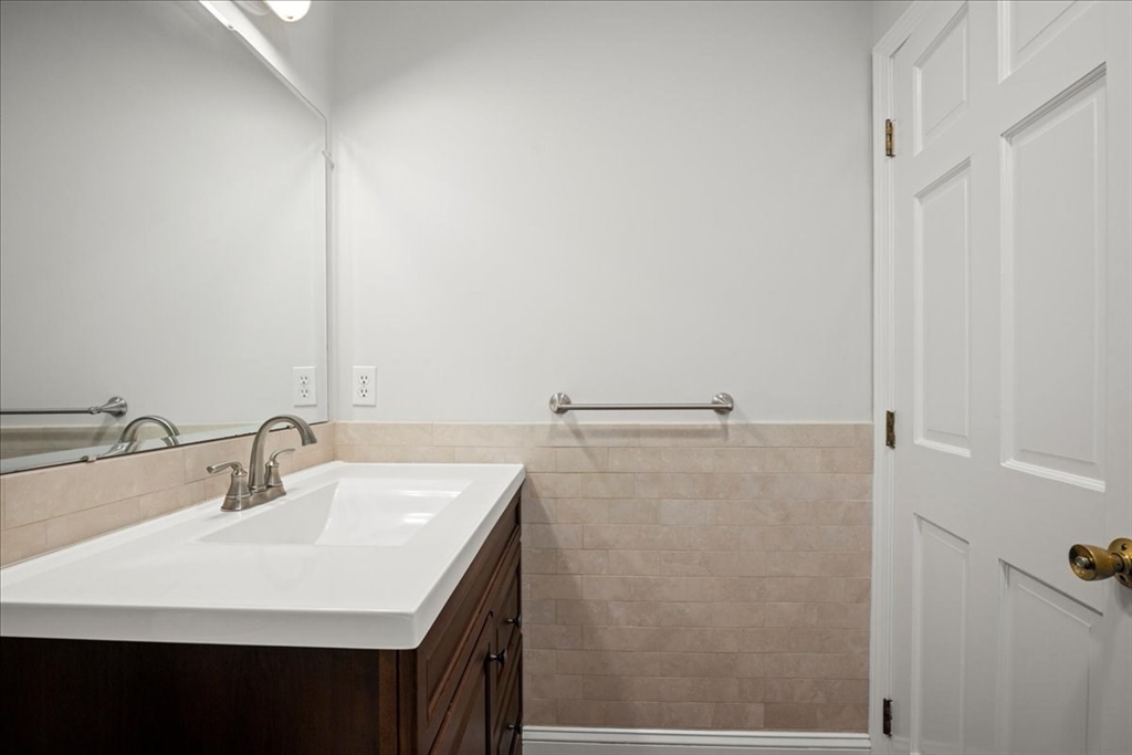 8 Arch Street Shrewsbury, MA 01545 - Photo 17 of 42 a bathroom with a sink and a mirror